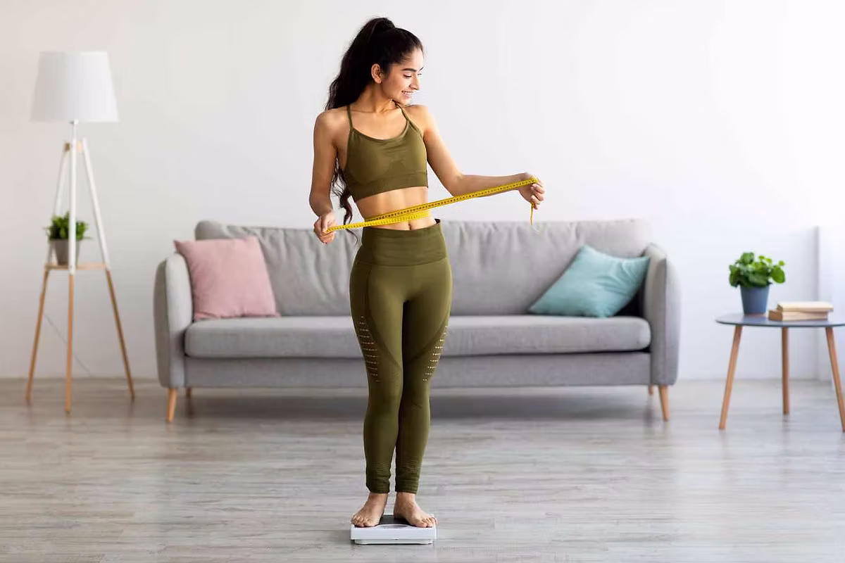 Woman measuring waist